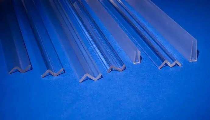 Clear plastic profiles resting on blue background