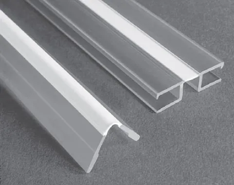 2 clear coextruded thermoplastic living hinges on a grey background