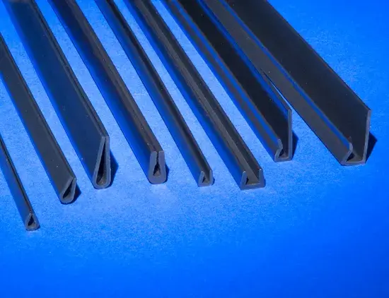 8 different types of Nyla-Glide GR stock plastic profile shapes resting on a blue background